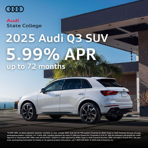 Three quarter side profile view of an Audi Q3 parked.
